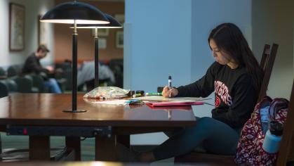 Student studying in Alexander Library