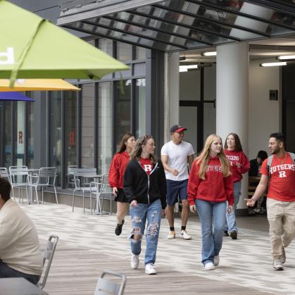 Students walk in The Yard on College Avenue.