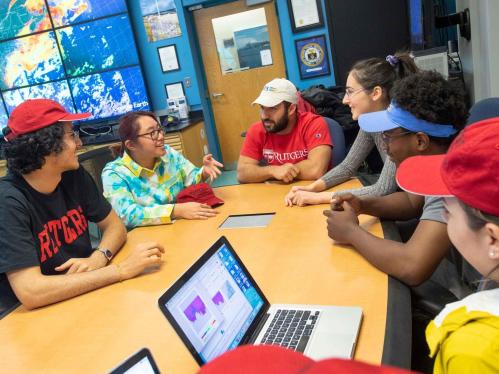 students conversing at table
