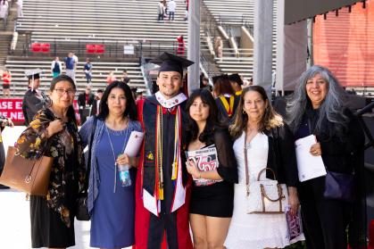 Rutgers University Student Assembly President Christopher Godoy with his mother (left), sister (right) and aunts at the 260th commencement